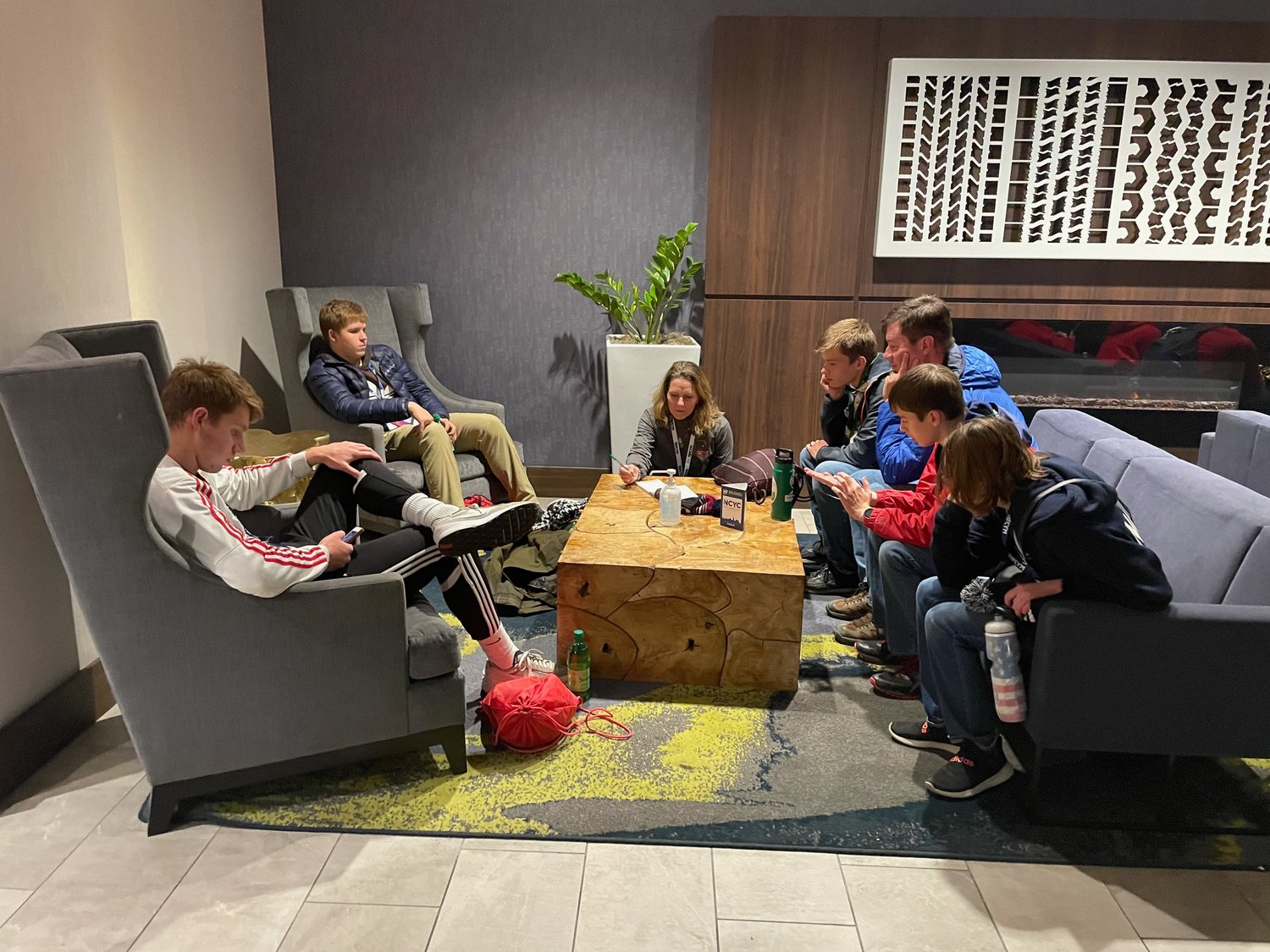 A group of teens from the Jefferson City diocese meets for faith sharing in the hotel after the closing Mass at the National Catholic Youth Conference in Indianapolis.